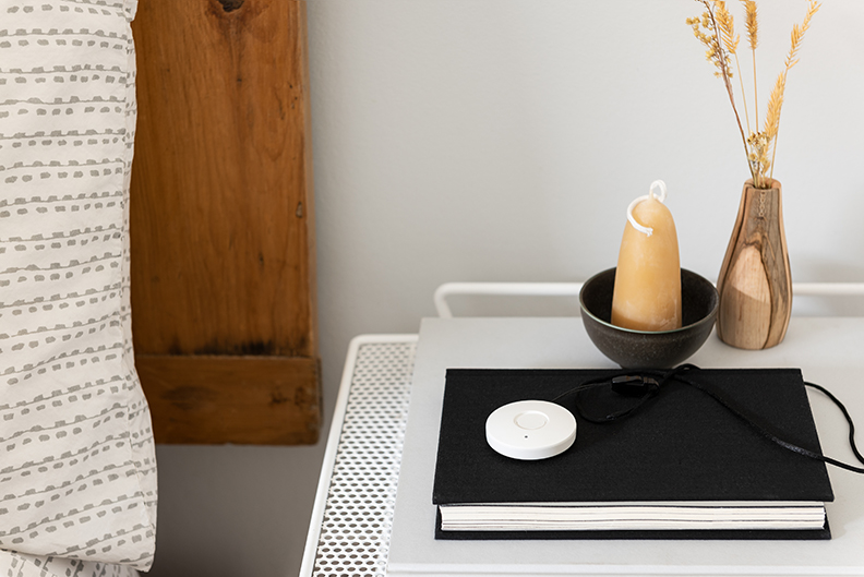 Medical Alert Necklace on Bedside Table