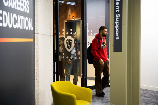 Student walking into building