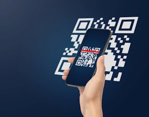 Hand using mobile smart phone scan Qr code